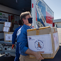 U.S. Representative Greg Stanton Helping to Load Supplies